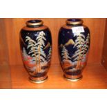 Pair of good Quality Japanese Satsuma Vases decorated with Pagoda and Fir trees, red character