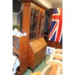 Large glazed 19th century bureau bookcase with traditional inlay work.