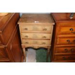 Edwardian Bedside table of 3 drawers with brass handles over tapering legs