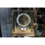 Kieninger & Obergfell Electric clock with numeral face and brass case