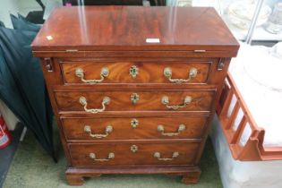 Small early 20th century chest of four drawers with fold out top.