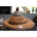 Broad brimmed traditional African tribal Mokorotlo hat from Lesotho in the form of Mount Qiloane.