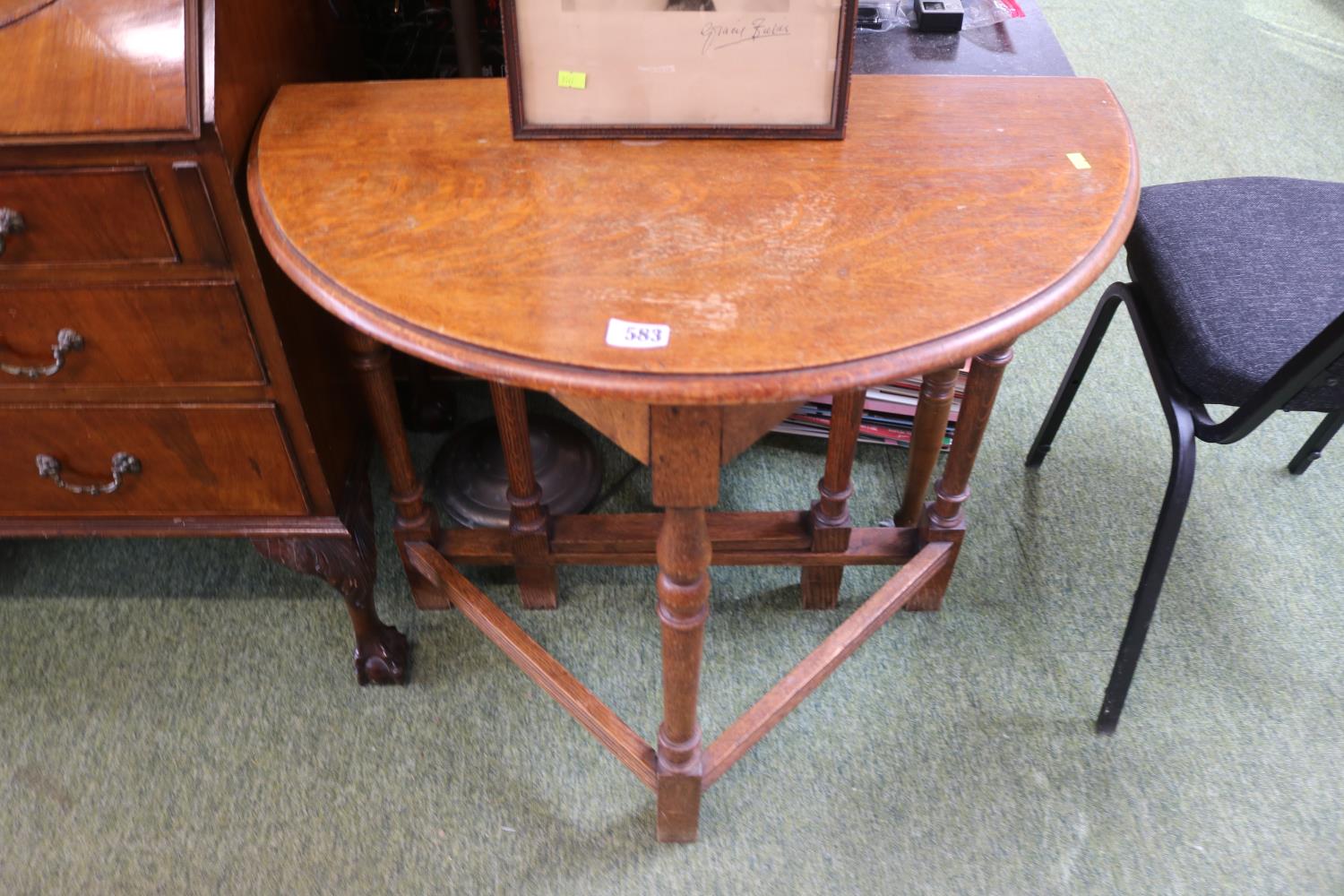 Oak corner drop leaf Cricket type table with turned supports and straight stretchers