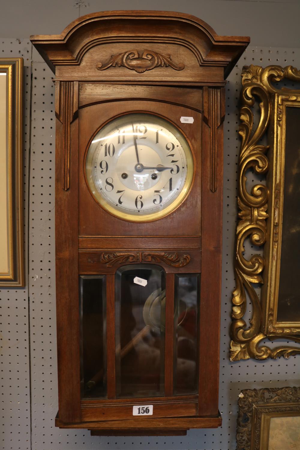 Oak Cased Glazed wall clock with numeral dial
