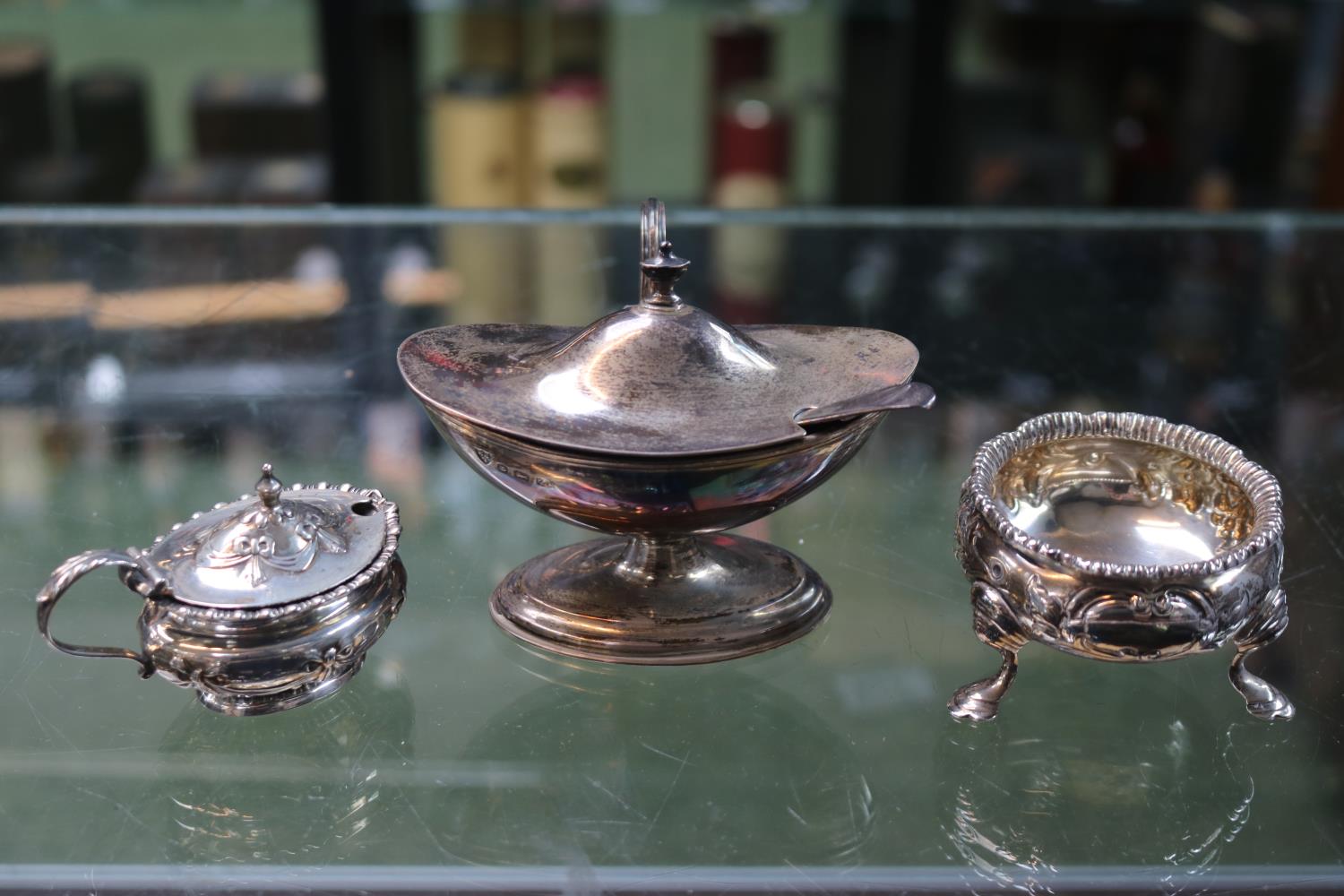 Silver embossed open Salt, lidded Silver salt and a Oval lidded blue glass lined salt Birmingham