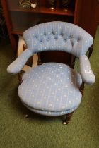 19thC Upholstered Low Elbow chair with button-back upholstery over Fluted legs and ceramic casters