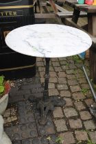 Circular Marble topped table with Cast iron base