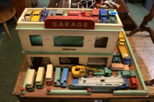 Vintage Shell Garage with a good collection of assorted Play worn Dinky vehicles