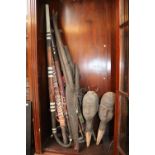 Collection of assorted African Ethnographic Swords, Rifle and a Pair of Hardwood carved heads