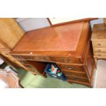 20thC Pedestal desk with Leather inset top above 9 drawers with brass drop handles