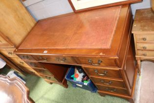20thC Pedestal desk with Leather inset top above 9 drawers with brass drop handles