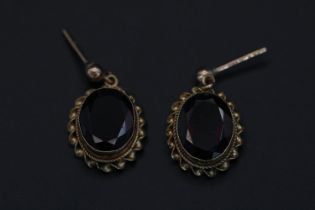 Pair of Good Quality Oval facetted Almandine Garnet on scroll gold mounts 2.6g total weight