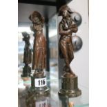 Pair of Good quality Bronze figures of a Regency Gentleman and woman mounted on cylindrical base.