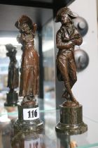 Pair of Good quality Bronze figures of a Regency Gentleman and woman mounted on cylindrical base.