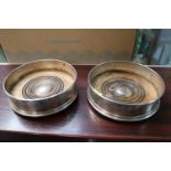Pair of 20thC Silver Wine Coasters with turned wooden bases. 13cm in Diameter