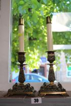 Pair of Late 19thC Foliate pierced candlesticks with Dolphin supports and later Candle inserts. 35cm