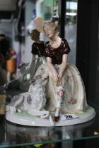 Fasold & Stauch Art Deco Lady seated with Hound on oval base. 23cm in Height