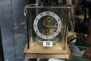 Kieninger & Obergfell Electric clock with numeral face and brass case