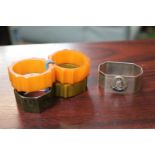 Collection of 4 Early Bakelite Napkin rings and a 1953 Queen Elizabeth II Napkin ring