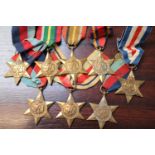 Collection of WWII Stars to include Pacific, Burma Star, 1939-45 Star, Africa Star, France & Germany