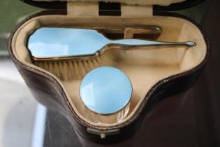Good Quality Cased Silver Enamelled travelling dressing table set comprising of Powder pot, Brush