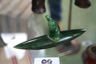 Nephrite Jade Inuit figure of a man in Canoe