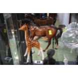 Beswick Baby Giraffe and a Beswick Cantering Horse with printed marks to base