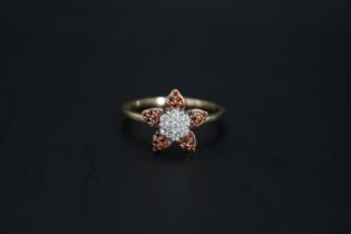 Ladies 10K Gold Diamond Diamond Cluster set ring in the form of a Flower 0.50ct total estimated