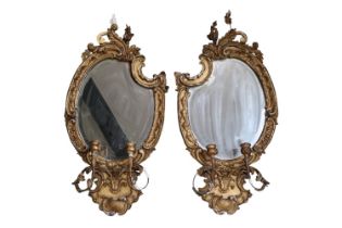 Pair of Gilt Gesso George III Wall mirrors with candle holders, shaped bevelled mirror and foliate