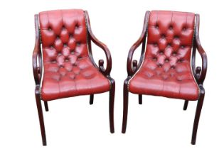 Pair of 20thC Chesterfield Button back Red Leather studded Elbow chairs with scroll arms