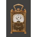 Edwardian gilded travelling clock fitted with 8 Day Hebdomas 8 day movement. The Case embossed