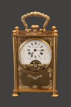 Edwardian gilded travelling clock fitted with 8 Day Hebdomas 8 day movement. The Case embossed