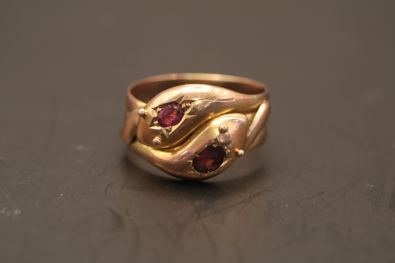 A Victorian double serpent head 9ct gold and Ruby ring. Set with two Oval facetted Rubies - Image 2 of 2