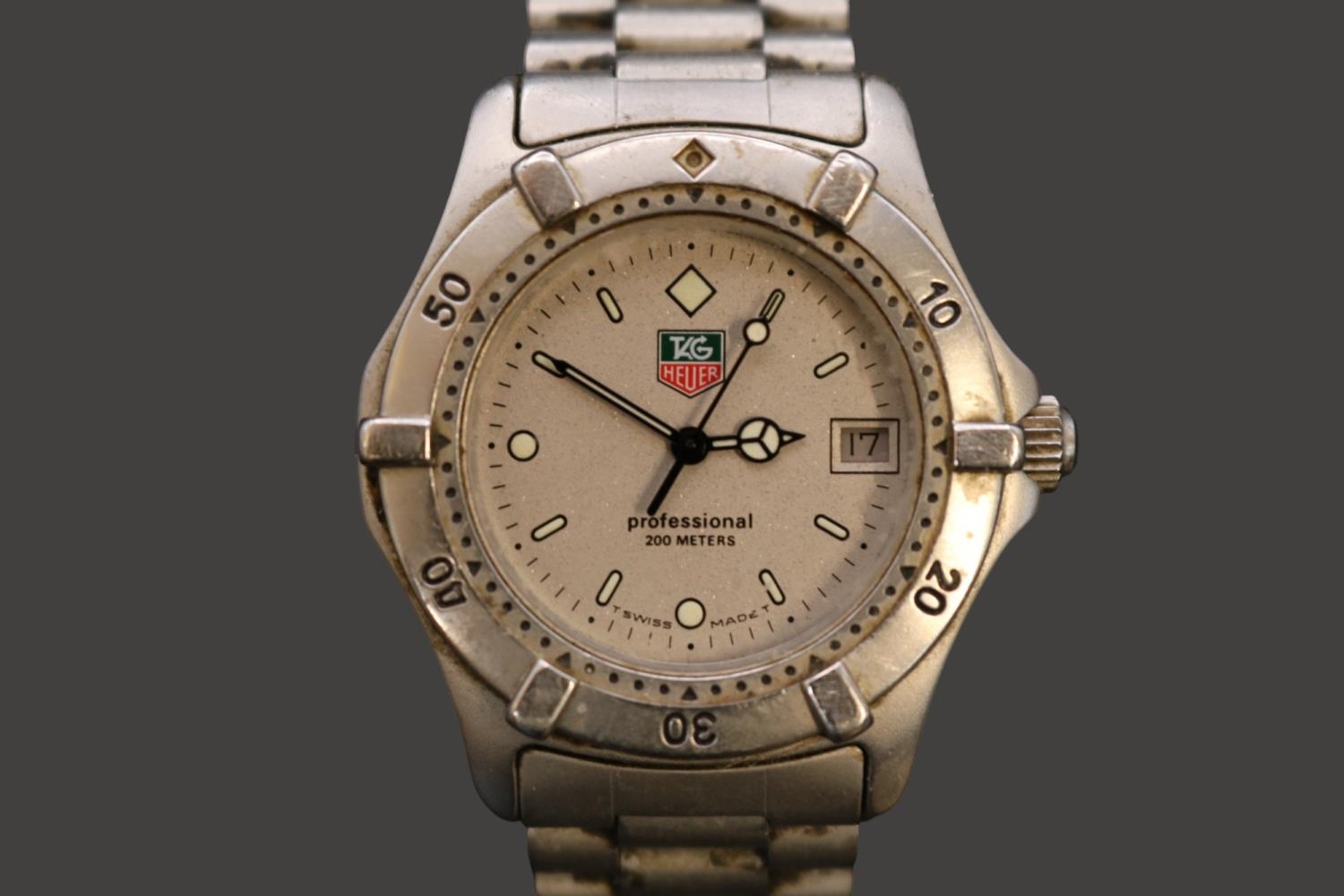 Tag Heuer Professional 200m Swiss quartz watch with date window & Silver coloured dial. 36mm case