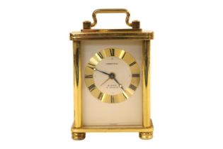 Tiffany & Co 8 Day 15 Jewels carriage clock of diminutive size with roman numeral dial. 90mm in