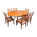 G-Plan Mid Century Oval dining table with cantilever leaf and 6 Matching Chairs with paper labels.