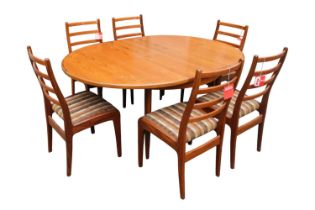 G-Plan Mid Century Oval dining table with cantilever leaf and 6 Matching Chairs with paper labels.