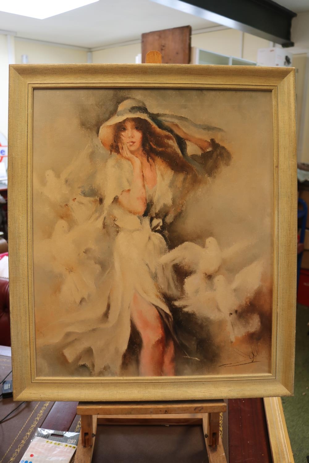 Oil on canvas of a girl surrounded by doves, indisticlty signed to bottom right. 59 x 48cm
