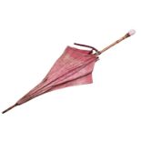 A Vintage Kendall parasol, with White and Maroon floral decoration, the carved bone handle formed as