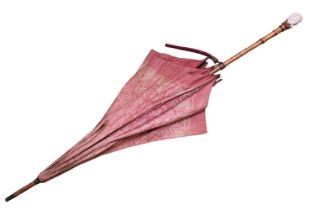 A Vintage Kendall parasol, with White and Maroon floral decoration, the carved bone handle formed as