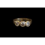 Ladies 18ct Gold 1.00ct Diamond Ring of 3 Brilliant Cut Stones with rub over mounts Size M. 3.8g