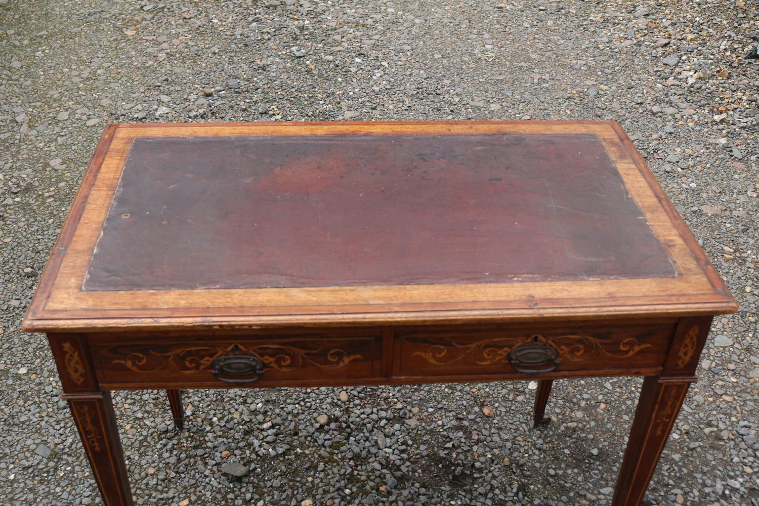 Edwardian Rosewood veneered two drawer desk on tapering legs and brass caster feet. 89cm in Width - Image 3 of 3