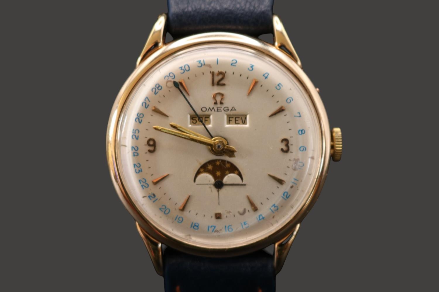 Omega Moon phase day date 17 jewel manual wind watch circa 1952. (MOVEMENT SIZED)