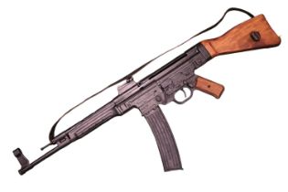A Denix Reproduction metal AK47 with magazine and box - missing wooden handle grip