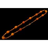 Ladies Amber and 9ct gold beaded necklace. 48 Oval Amber beads 3mm to 8mm with 9ct gold beads