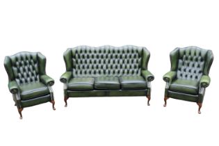 Green Leather Chesterfield Wing arm sofa suite comprising of 3 seater sofa and matching armchairs on