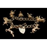 Early 20thC 9ct Gold Charm bracelet comprising of Seven charms to include Tiger, Bull, Turtle,