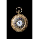 18K Ladies Pocket watch with Roman Numeral Dial 38g total weight with movement. 35mm in Diameter