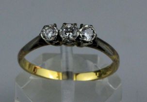 18ct Gold & Platinum Three Stone Brilliant Cut Diamond Ring 0.25ct. An 18ct yellow gold ring with