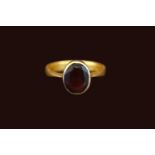 22ct Gold Rub over set Oval Almandine Garnet 2.9ct estimated weight. Size Q. 5.8g total weight